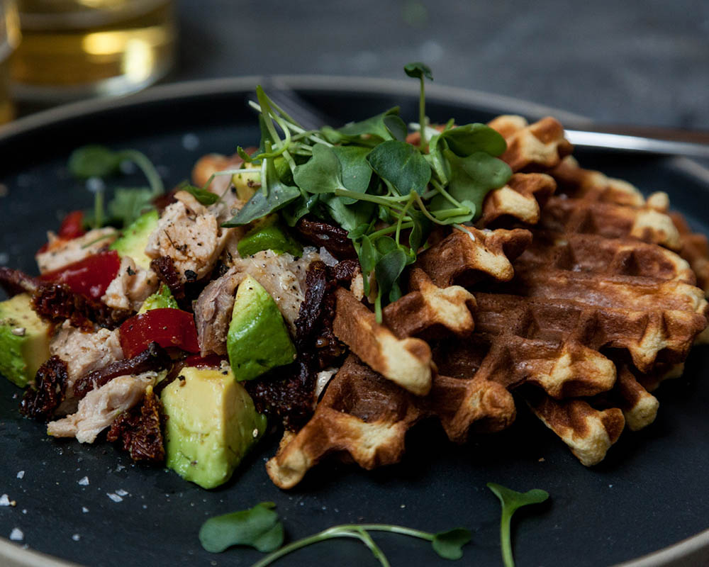 Chickpea waffles with turkey BLTA salad