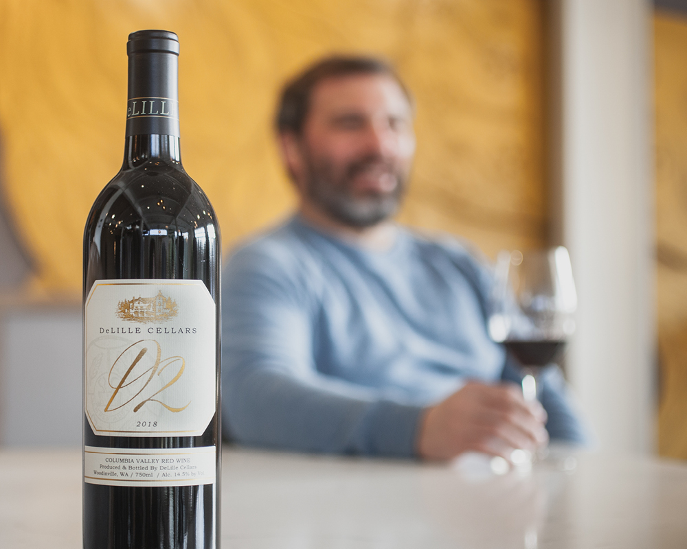 Delille Cellars D2 wine with Jason Gorski blurred in the background