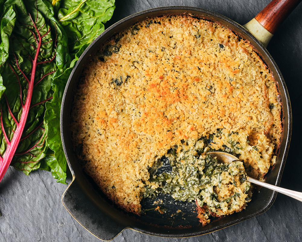 Skillet filled with Swiss Chard Gratin
