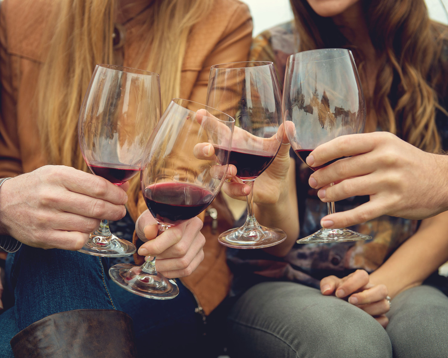 People toasting with red wine