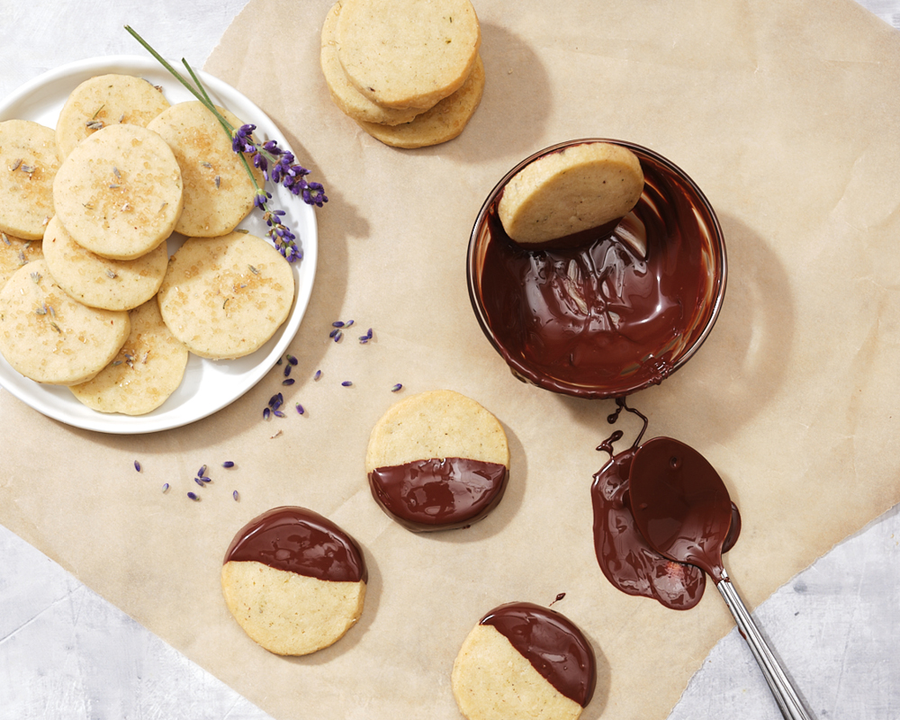 Lavender shortbread cookies with bowl of melted chocolate