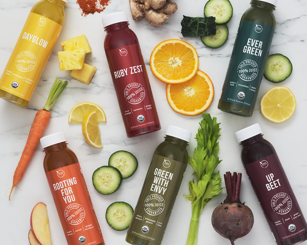 Six Metropolitan Market juices styled with fresh produce